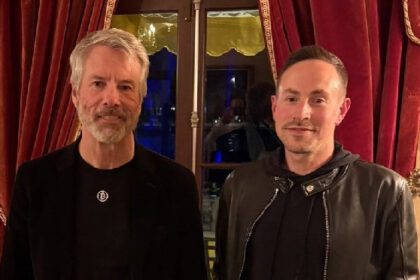 CEO is rumoured to buy Bitcoin after posing with BTC Bull Michael Saylor