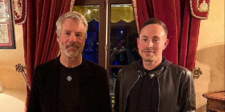 CEO is rumoured to buy Bitcoin after posing with BTC Bull Michael Saylor