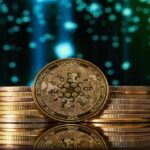 Golden Cardano ADA coin stacked with other coins against blue digital background